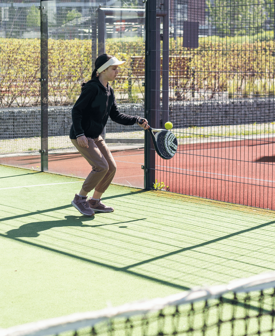 Young Girls Playing Padel on a Sunny Day