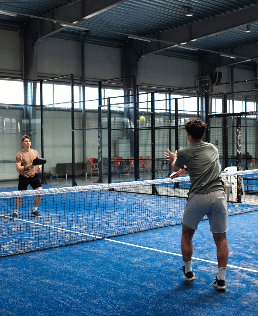 people-playing-padle-tennis-inside (1)