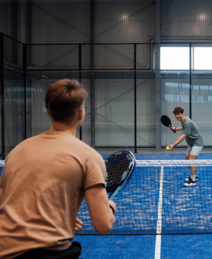 people-playing-padle-tennis-inside